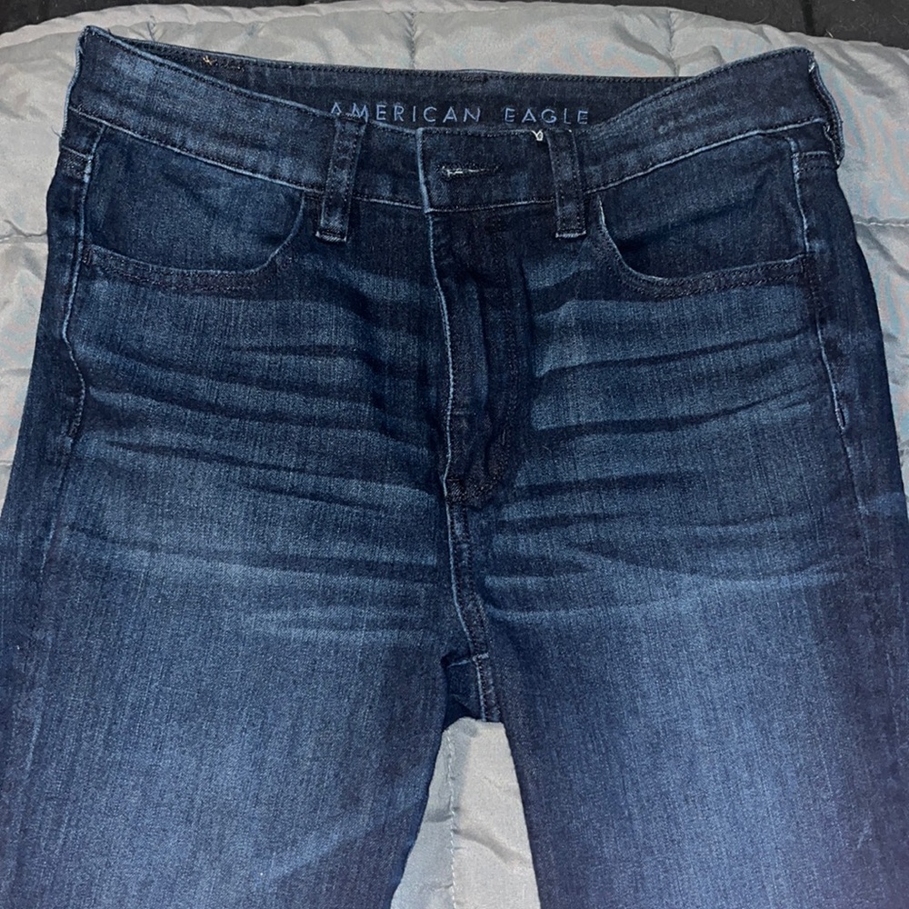 Super stretchy American eagle skinny jean. Very dark blue denim Great condition